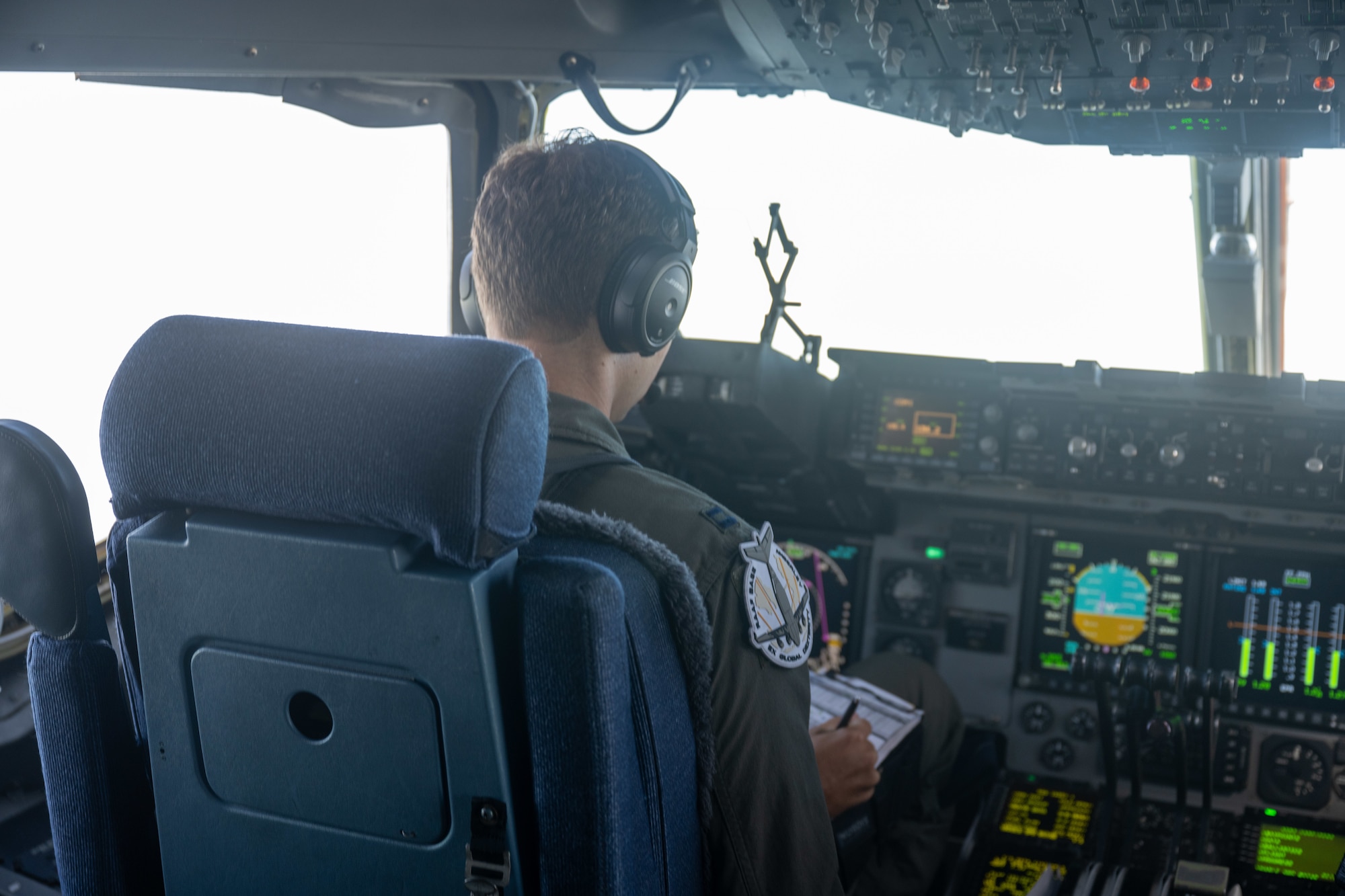 A U.S. Air Force pilot pilots a C-17 Globemaster III over Australia.
