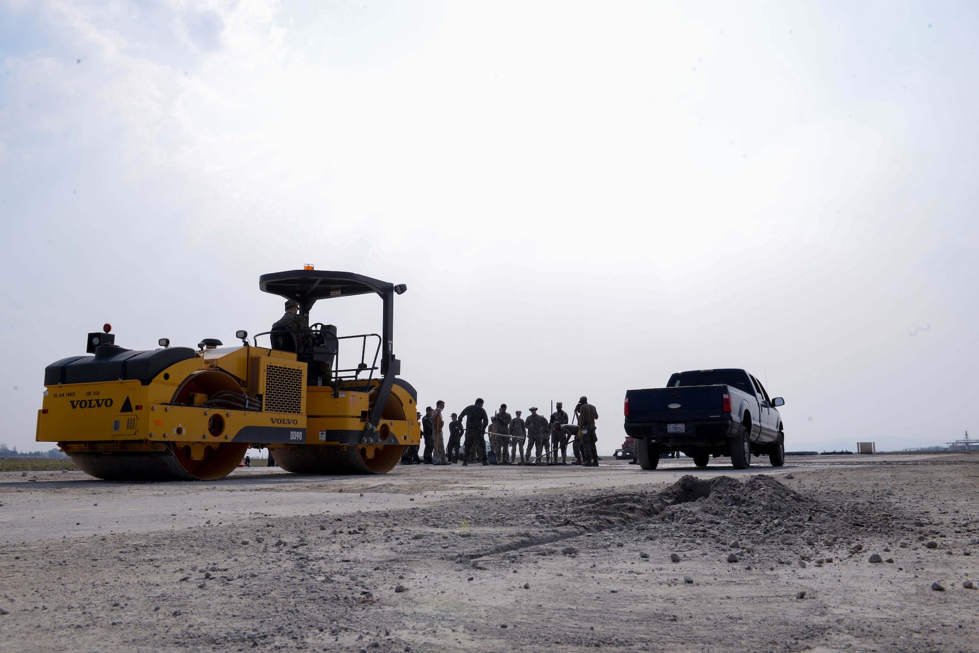 Members of the U.S. Air Force, U.S. Army, and Republic of Korea Air Force participate in a hands-on rapid airfield damage repair familiarization training hosted by the 51st Civil Engineer Squadron at Osan Air Base, Republic of Korea, April 14, 2025. RADR is a process for repairing structural damage on airfields to restore combat airpower generation. The training allowed engineers assigned to contingency operating bases across the Korean peninsula to learn the RADR process and use heavy equipment to accomplish each step of the RADR mission. (U.S. Air Force photo by Staff Sgt. Kahdija Slaughter)