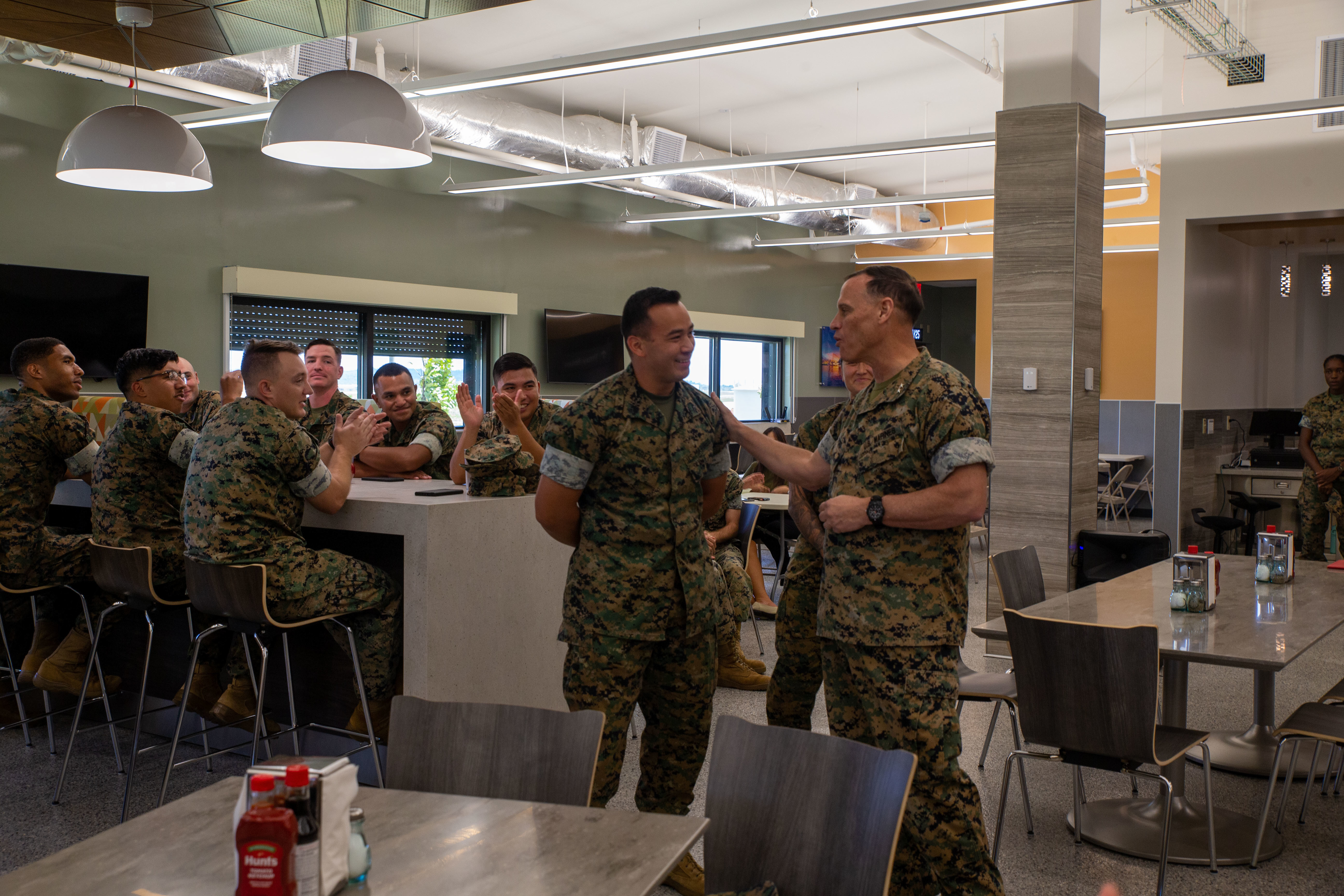 U.S. Marine Corps Maj. Gen. Brian Wolford, commanding general, Marine Corps Installations Pacific, recognizes Lance Cpl. Paul Jr. Perez, personnel clerk, Marine Corps Base Camp Blaz, at Andersen Air Force Base, Guam, April 24, 2025. Wolford and his staff visited Camp Blaz to see the progression of the base’s development and capabilities. (U.S. Marine Corps photo by Lance Cpl. Afton Smiley)