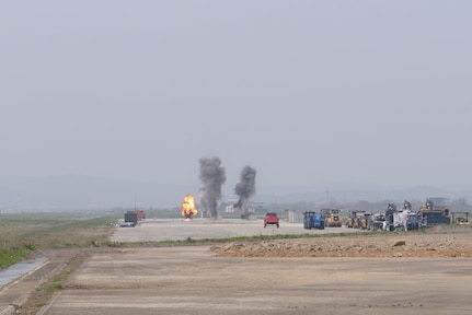 U.S. Airmen assigned to the 51st Civil Engineer Squadron explosive ordnance disposal flight set off several explosions on a controlled airfield pad in preparation for the first complex, joint and combined IRON RADR exercise at Osan Air Base, Republic of Korea, April 18, 2025. Rapid airfield damage repair is a process for repairing structural damage on airfields to restore combat airpower generation. The contributions of the EOD Airmen enhanced the realism and complexity of IRON RADR. (U.S. Air Force photo by Staff Sgt. Kahdija Slaughter)