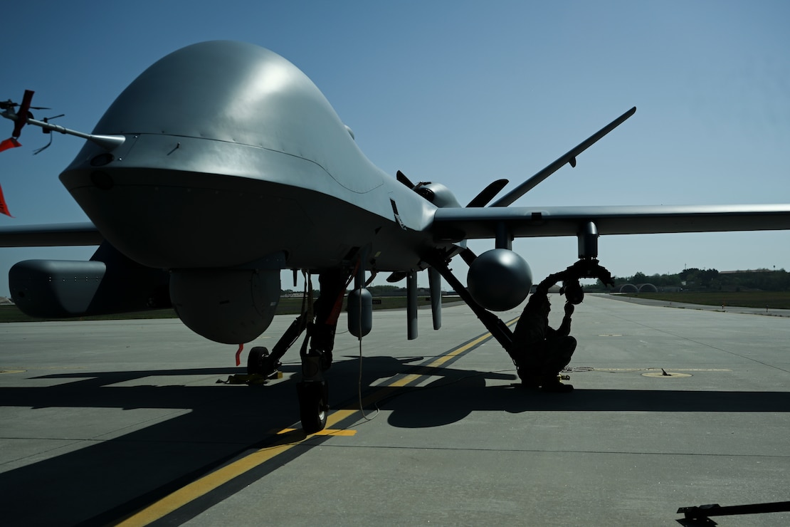 U.S. Air Force Senior Airman Colby Delia, 9th Expeditionary Bomb Squadron crew chief, marshals a B-1B Lancer on a flight line during Bomber Task Force 25-2 at Misawa Air Base, Japan, May 3, 2025.