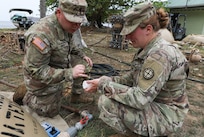 Spc. Colton Hines, left, and Sgt. Jessica Shields, water purifications specialists with the 935th Aviation Support Battalion, Missouri Army National Guard, check the chlorine levels of the water meant for cooking and cleaning laundry during TRADEWINDS 25 (TW25) exercise at Teteron Bay, Trinidad and Tobago, April 27, 2025.