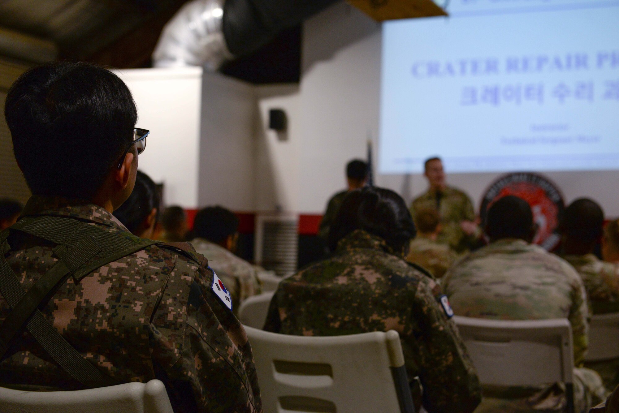 Members of the U.S. Air Force, U.S. Army, and Republic of Korea Air Force participate in a rapid airfield damage repair familiarization training for the first complex, joint and combined IRON RADR exercise at Osan Air Base, Republic of Korea, April 14, 2025. The goal of IRON RADR was to test, evaluate and prepare joint and allied engineers to respond to simulated threats during repair operations; increasing survivability against continued air and ground attacks. (U.S. Air Force photo by Staff Sgt. Kahdija Slaughter)
