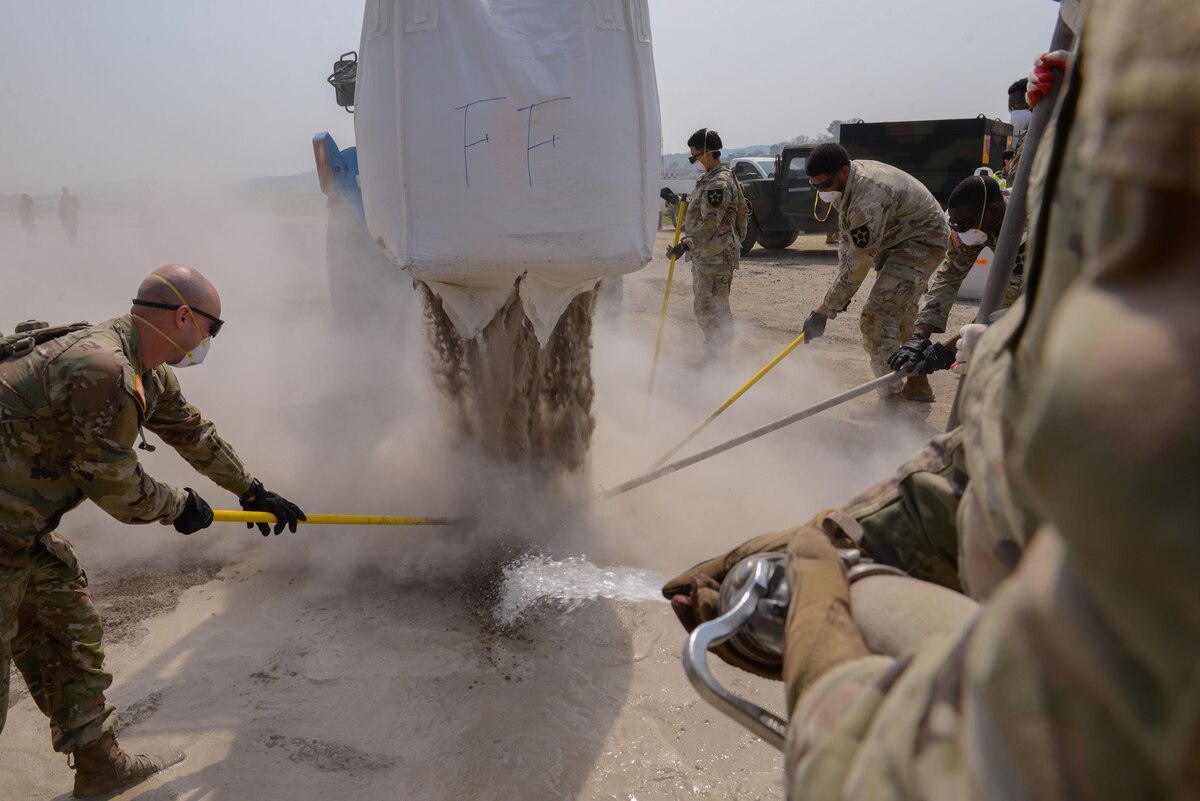 U.S. Soldiers assigned to the 11th Engineering Battalion and U.S. Airmen assigned to the 51st Civil Engineer Squadron mix flowable concrete fill during IRON RADR at Osan Air Base, Republic of Korea, April 24, 2025. The rapid airfield damage repair mission encompasses advanced pavement repair techniques and strategies that support airfield operations in degraded and contingency conditions, allowing swift restoration of combat airpower generation capabilities no matter the warfighting landscape. (U.S. Air Force photo by Staff Sgt. Kahdija Slaughter)