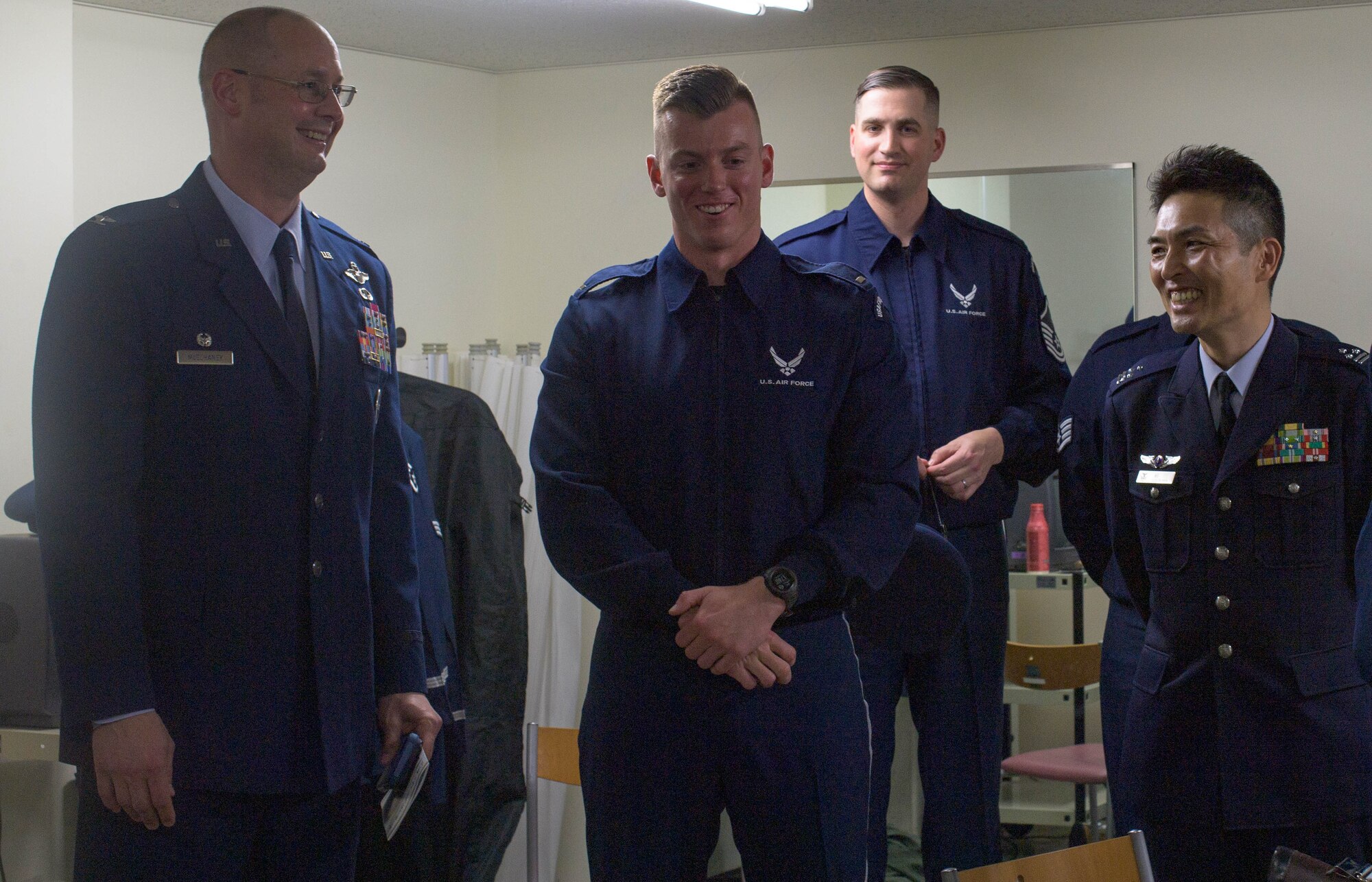 A man visits a team of drill members.