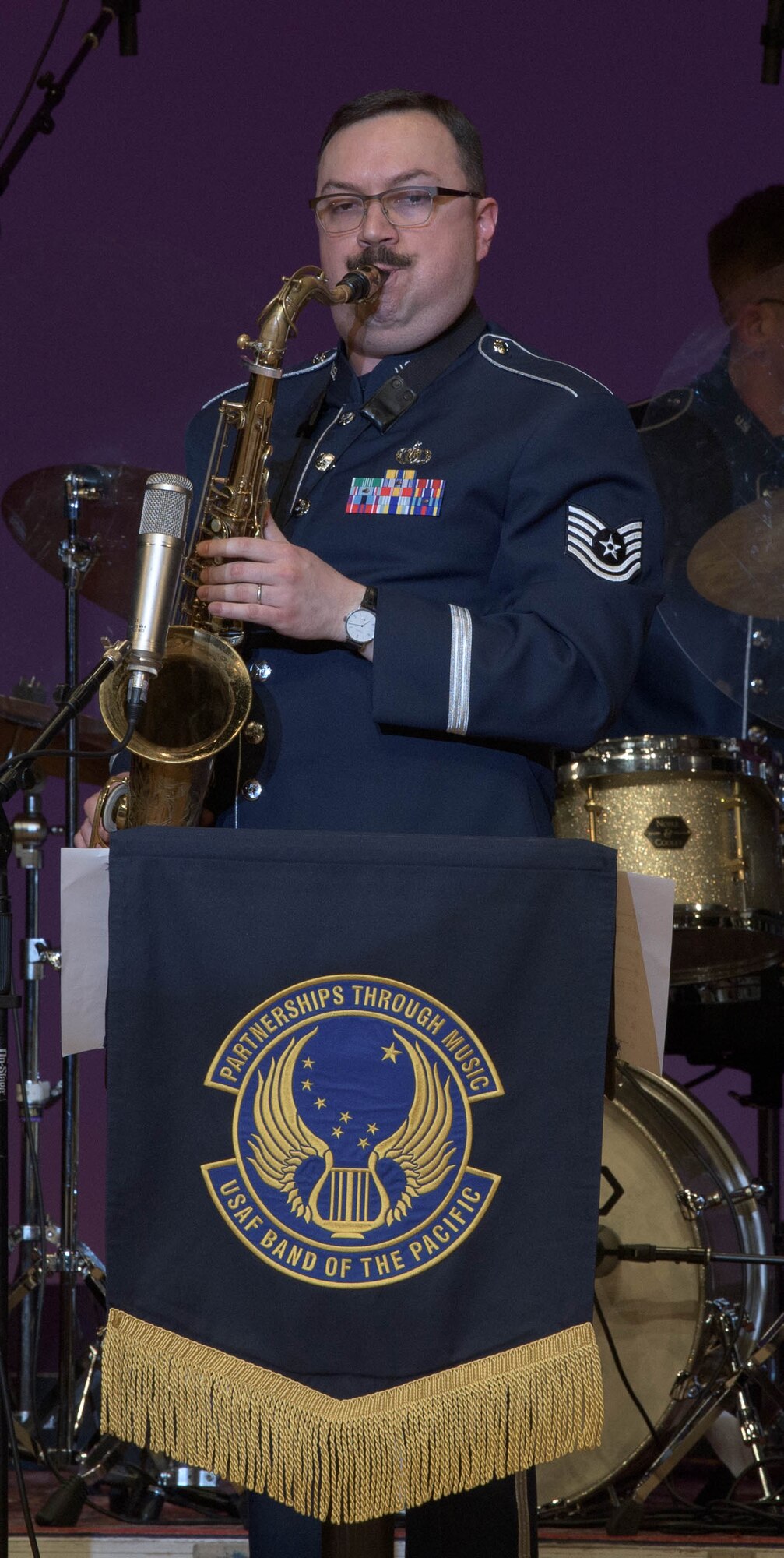 A saxophonist performs.