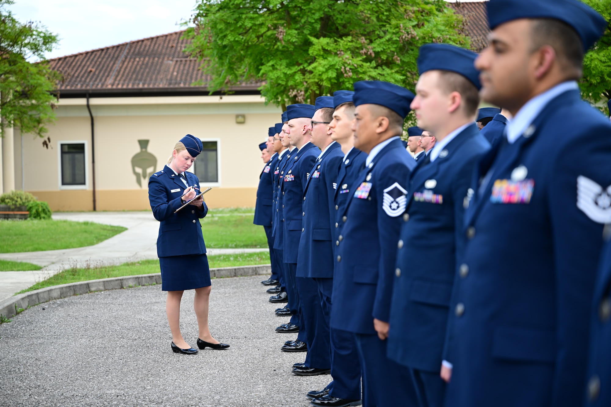 U.S. Air Force service member conducts uniform inspection.