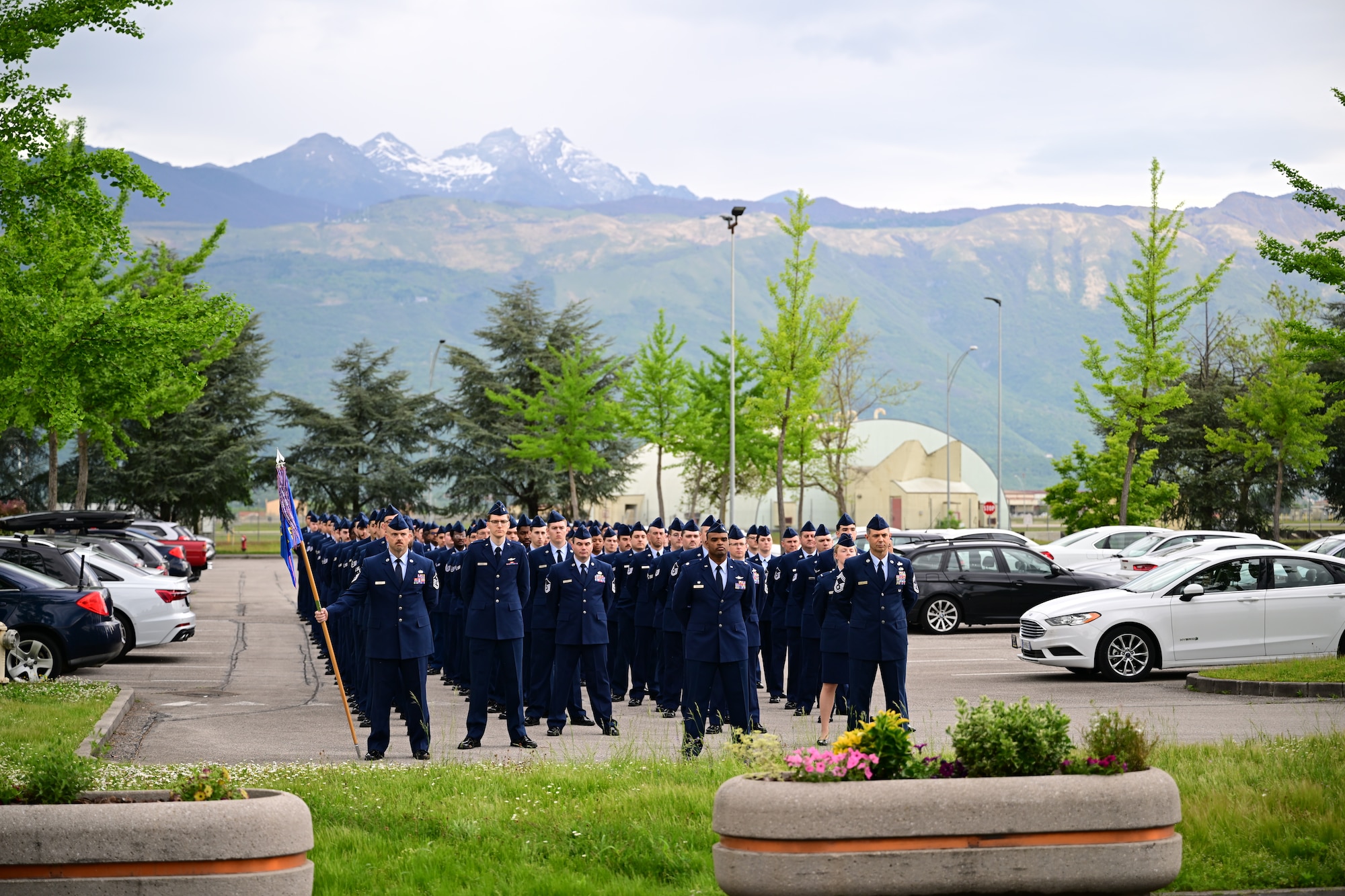 US Air Force members stand in a formation.