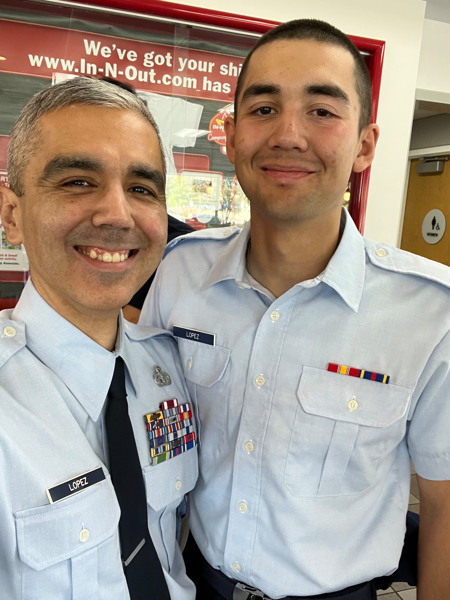 Daniel Lopez poses with his son, Ramon, at his basic training graduation.