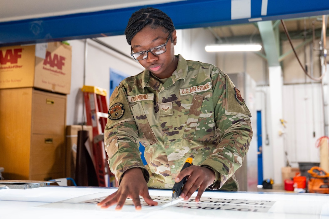 Airman using a light board