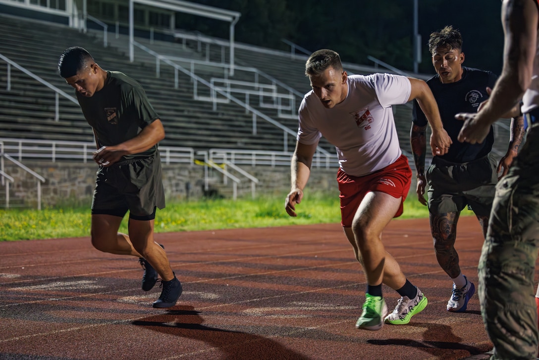 U.S. Marines conduct the “Beep Test” event during the Fittest Instructor Competition at Butler Stadium on Marine Corps Base Quantico, Virginia, April 26, 2025. The Fittest Instructor Competition brought together instructors from across the Marine Corps to go head-to-head in a series of demanding physical challenges-all to determine who truly earns the title of the fittest instructor. (U.S. Marine Corps photo by Lance Cpl. Braydon Rogers)