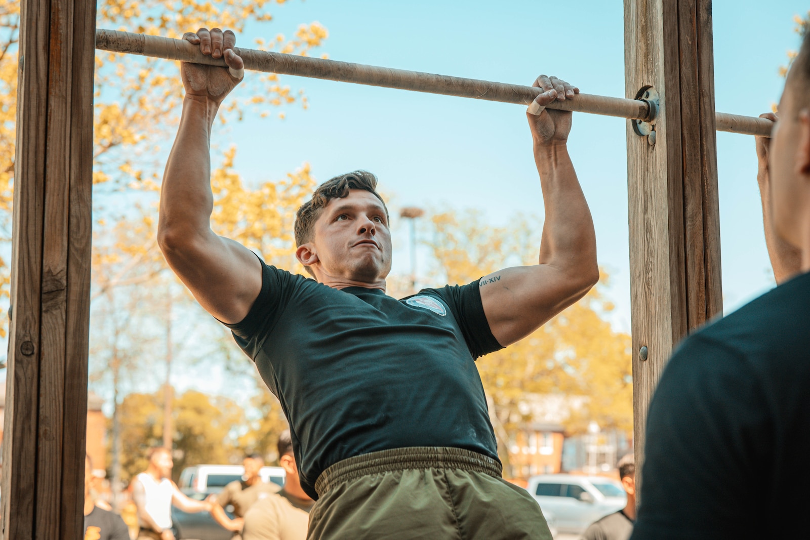 U.S. Marine Corps Sgt. Erin Michaeles, a competitor, conducts pull-ups during the cliff hanger event for the Fittest Instructor Competition at Barber Physical Activity Center Virginia, April 28, 2025. The Fittest Instructor Competition brought together instructors from across the Marine Corps to go head-to-head in a series of demanding physical challenges-all to determine who truly earns the title of the fittest instructor. (U.S. Marine Corps photo by Lance Cpl. Harleigh Faulk)