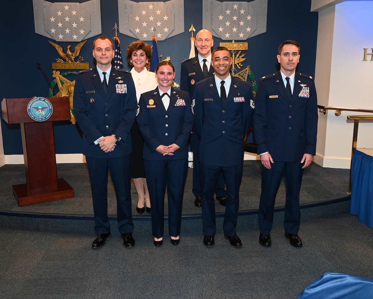 Air Force Chief of Staff Gen. David Allvin and Ms. Janine Sijan pose for a group portrait with the winners of the annual Lance P. Sign Award for Leadership.
