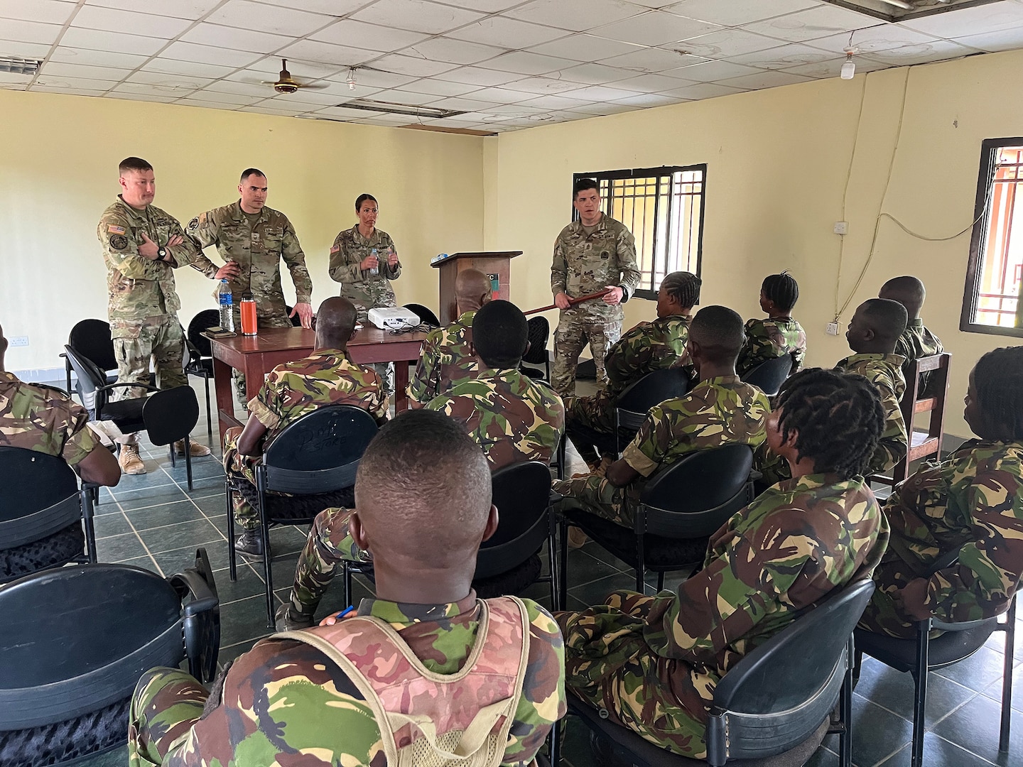 U.S. Army 1st Sgt. Derek Smith, 177th Regional Training Institute, Michigan National Guard, leads a discussion with instructors assigned to the Republic of Sierra Leone Armed Forces (RSLAF) Armed Forces Training Center, April 16, 2025, at the RSLAF AFTC, Benguema, Sierra Leone.