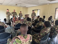 U.S. Army 1st Sgt. Derek Smith, 177th Regional Training Institute, Michigan National Guard, leads a discussion with instructors assigned to the Republic of Sierra Leone Armed Forces (RSLAF) Armed Forces Training Center, April 16, 2025, at the RSLAF AFTC, Benguema, Sierra Leone.