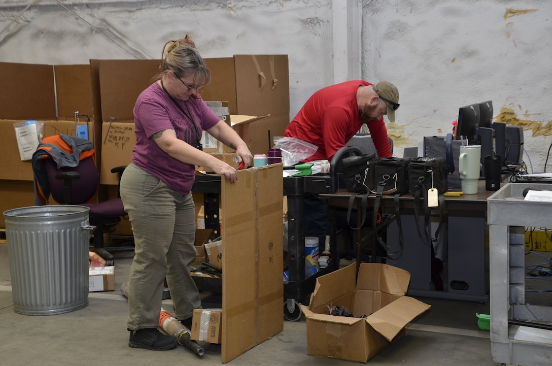 man and woman opening packages