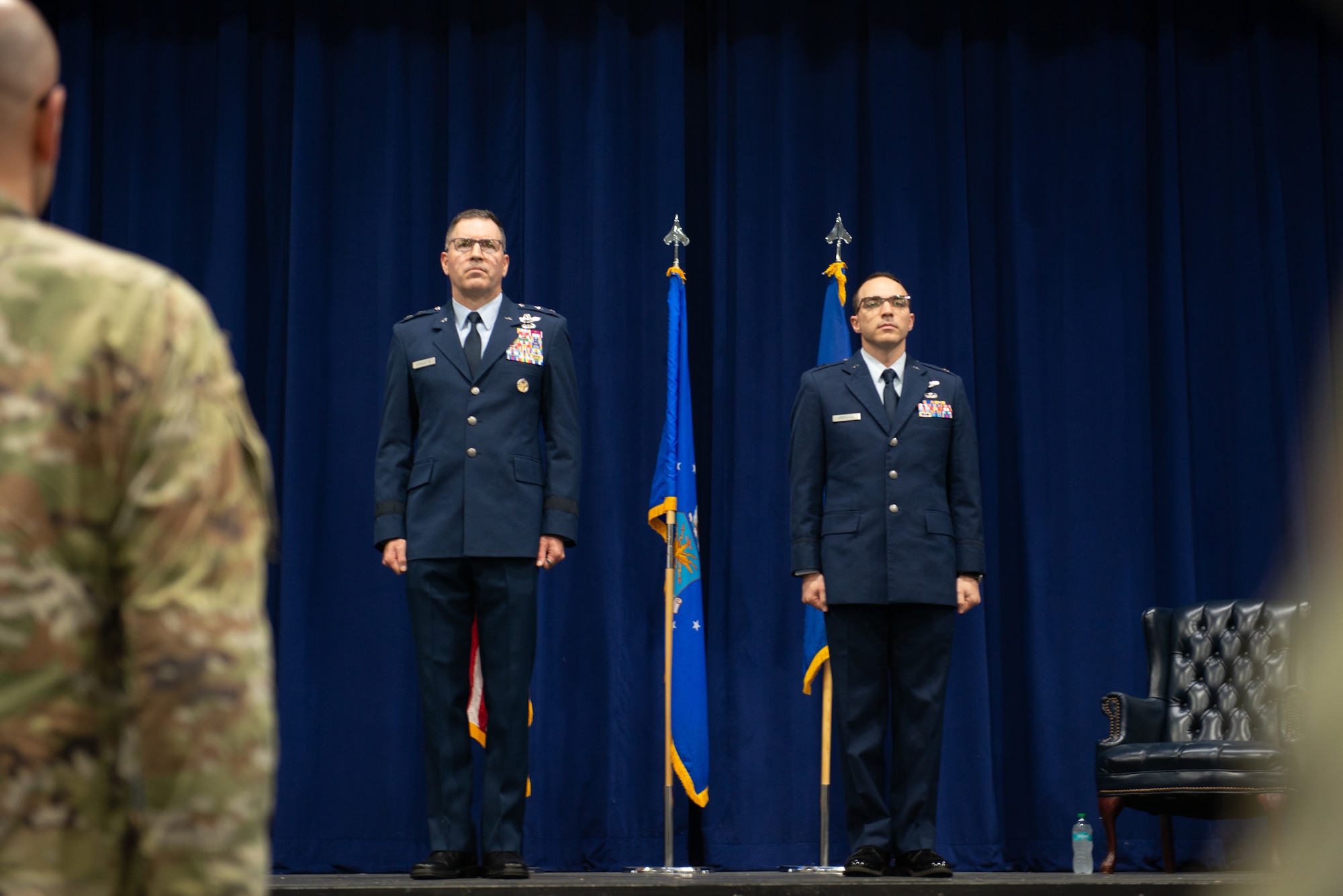 People standing on a stage.