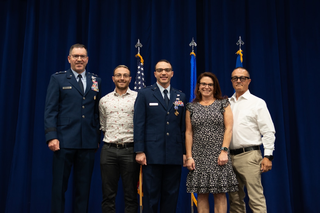 Photo of people standing on a stage