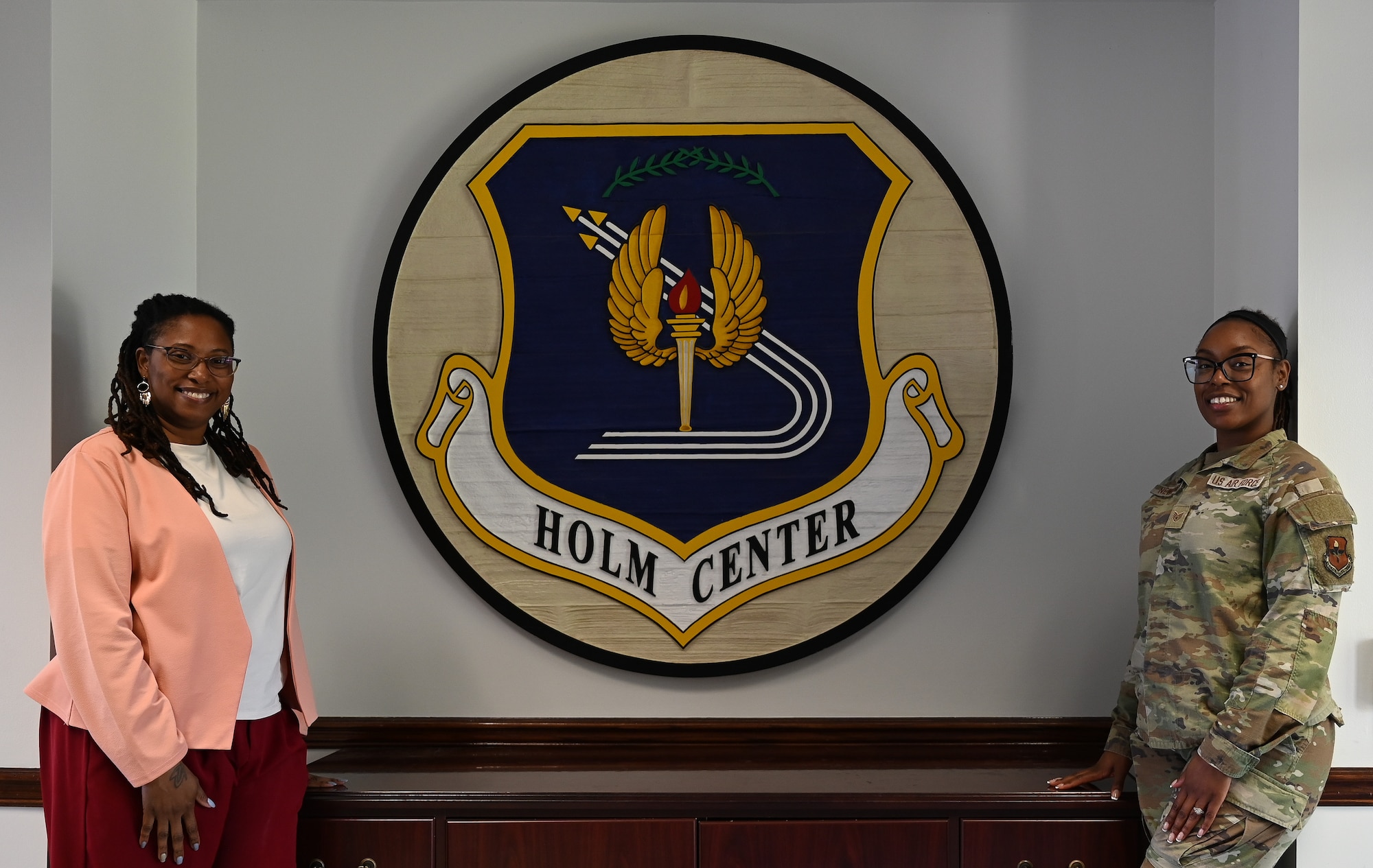 Sonja M. Simmons, Holm Center chief of protocol, and U.S. Air Force Staff Sgt. Jamilla Newberry, Holm Center protocol noncommissioned officer in charge, pose for a photo at Maxwell Air Force Base, Alabama, April 29, 2025.