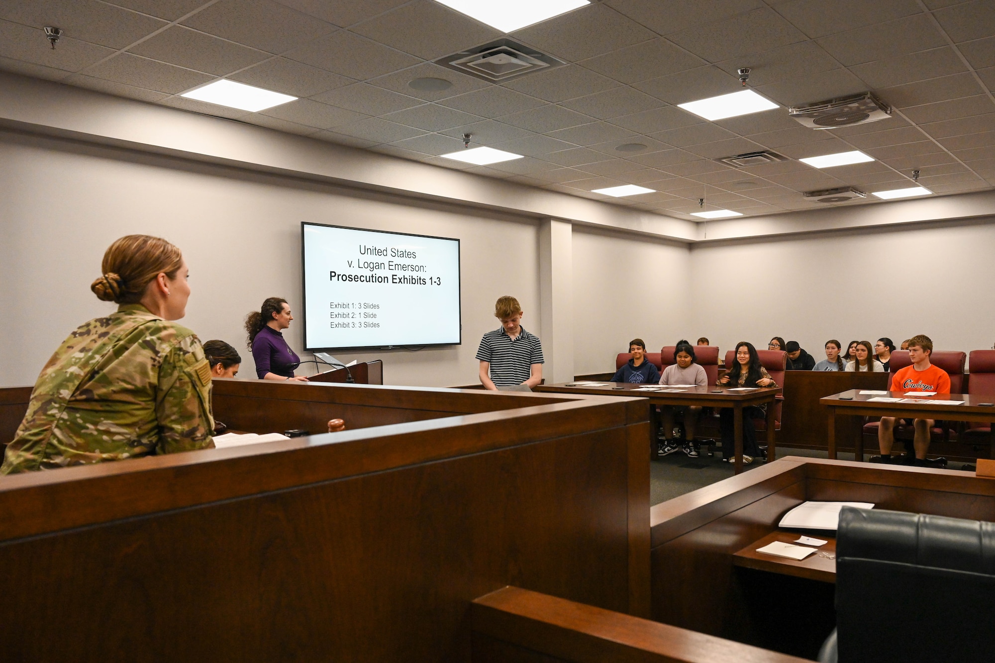 U.S. Air Force 1st Lt. Samantha Hulliberger, 97th Air Mobility Wing Judge Advocate (JA) adverse action chief, presides over a mock trial during Law Day at Altus Air Force Base, Oklahoma, May 1, 2025. Team members from JA gave Altus Junior High students advice on when to object, what kind of questions to ask a witness, and how to address a judge throughout the mock trial. (U.S. Air Force photo by Senior Airman Kari Degraffenreed)