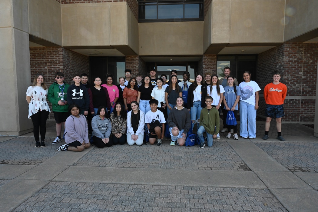Students from Altus Junior High School pose for a group photo at Altus Air Force Base (AFB), Oklahoma, May 1, 2025. The students came to Altus AFB for Law Day, an annual event put on by the 97th Air Mobility Wing Judge Advocate office to showcase military careers in law and criminal justice to students throughout the community. (U.S. Air Force photo by Senior Airman Kari Degraffenreed)