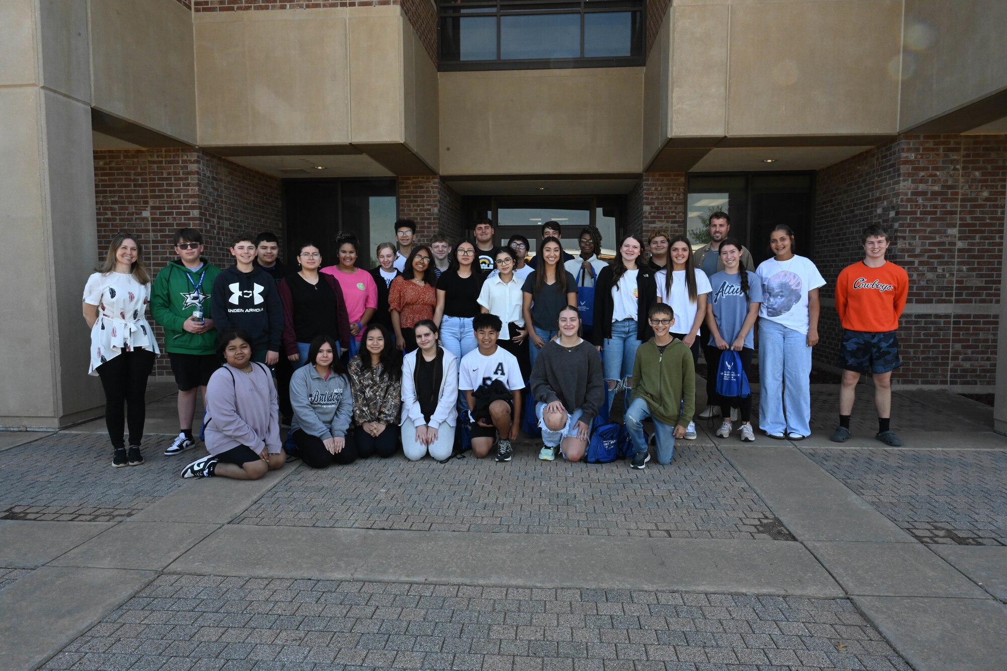 Students from Altus Junior High School pose for a group photo at Altus Air Force Base (AFB), Oklahoma, May 1, 2025. The students came to Altus AFB for Law Day, an annual event put on by the 97th Air Mobility Wing Judge Advocate office to showcase military careers in law and criminal justice to students throughout the community. (U.S. Air Force photo by Senior Airman Kari Degraffenreed)