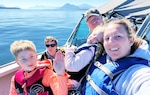 Morgan Holden, the Coast Guard’s 2024 Ombudsman of the Year, enjoys a day on the water with her family.
