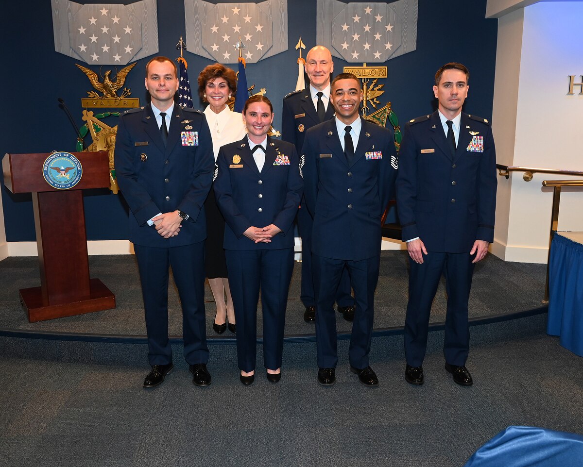 Air Force Chief of Staff Gen. David Allvin and Ms. Janine Sijan pose for a group portrait with the winners of the annual Lance P. Sign Award for Leadership.