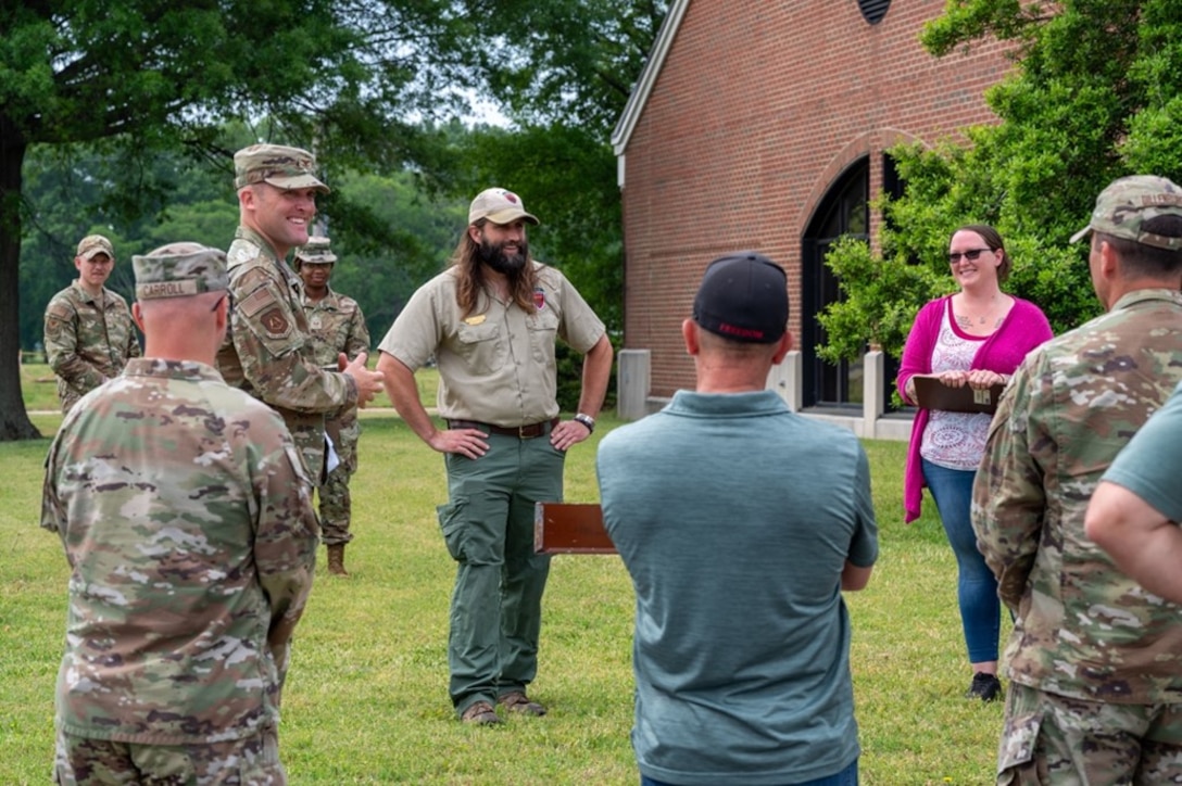 Man speaks to crowd of Airmen and civilians. (U.S. Air Force photo by Airman 1st Class Donnell Ramsey)