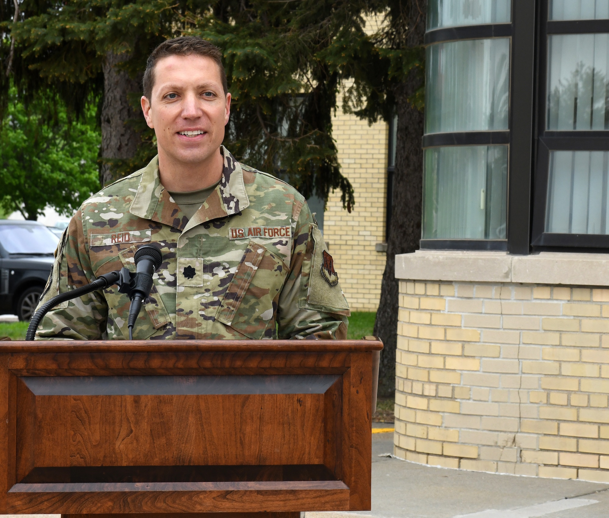 Airmen give speech in front of the SAC Heritage Law Center