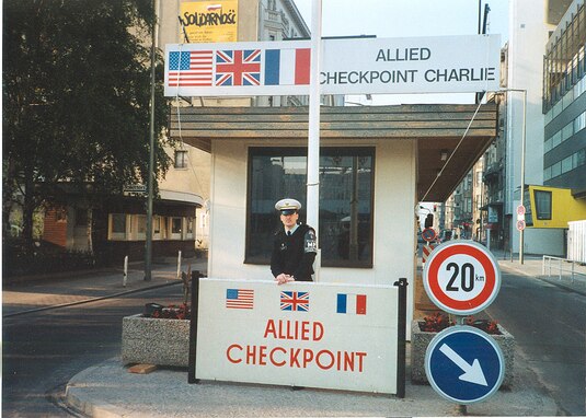 young Sgt. 1st Class Michael Rafferty, standing watch near the Berlin Wall