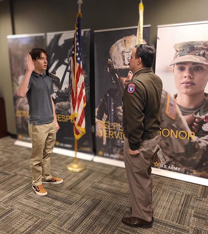 CPT Gabriel Santiago, Company Commander, Greensburg Recruiting Company, swears in Elijah Rafferty