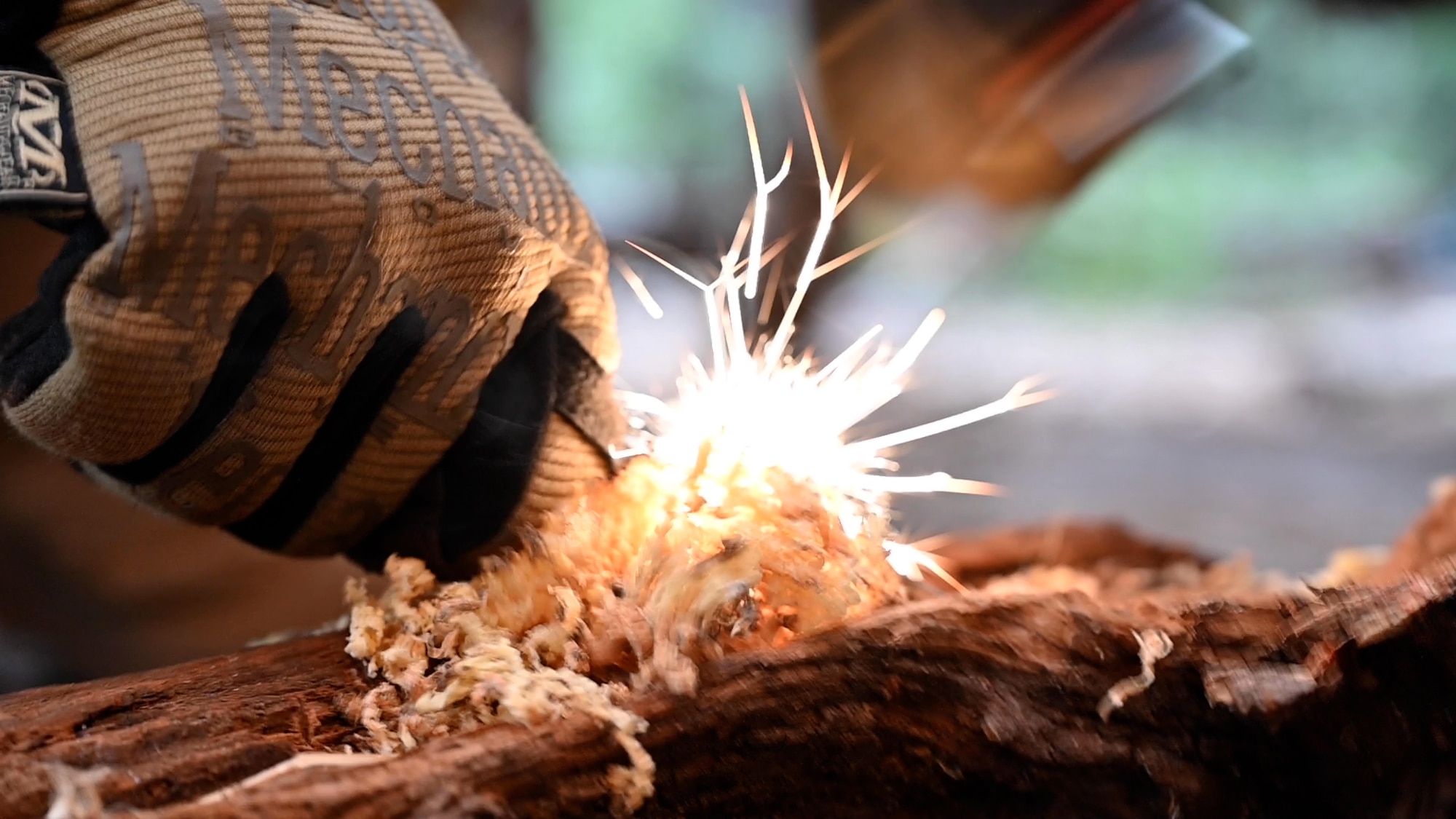 Hand strike flint to make a spark.