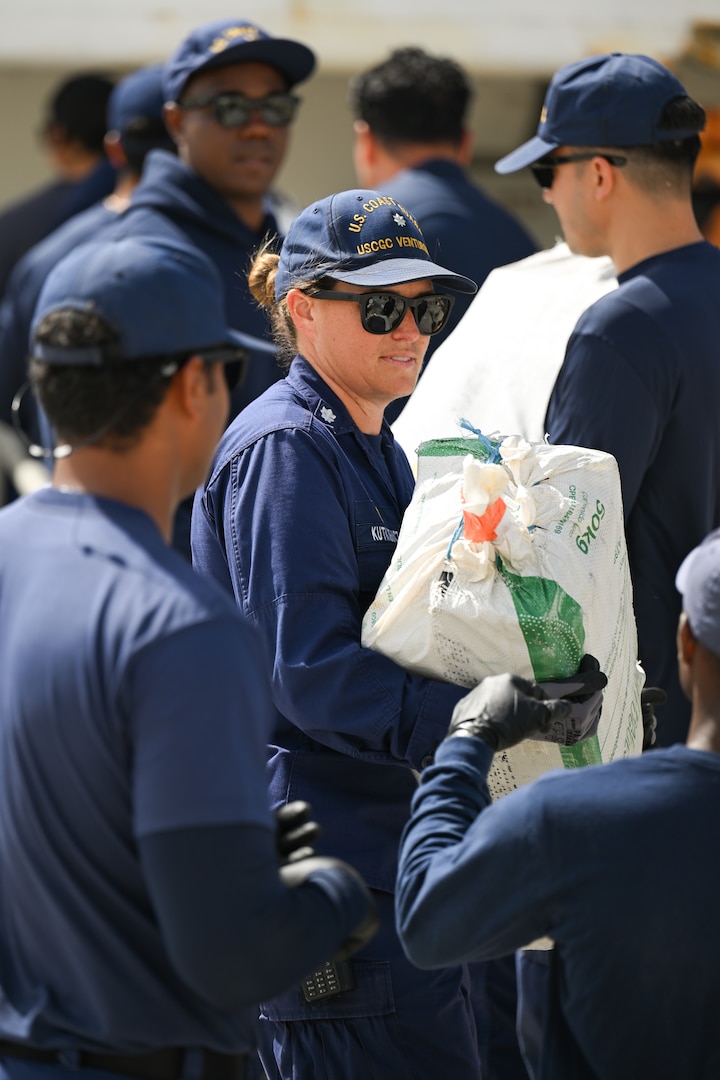 Bales of illegal narcotics are offloaded by crew members of Coast Guard Cutter Venturous at Coast Guard Base Miami Beach, May 2, 2025. The seized contraband was the result of four interdictions in the Caribbean Sea by the crews of USCGC Diligence (WMEC 616) and HNLMS Groningen (P843) with an embarked Coast Guard law enforcement detachment. (U.S. Coast Guard photo by Petty Officer 3rd Class Jessica Walker)