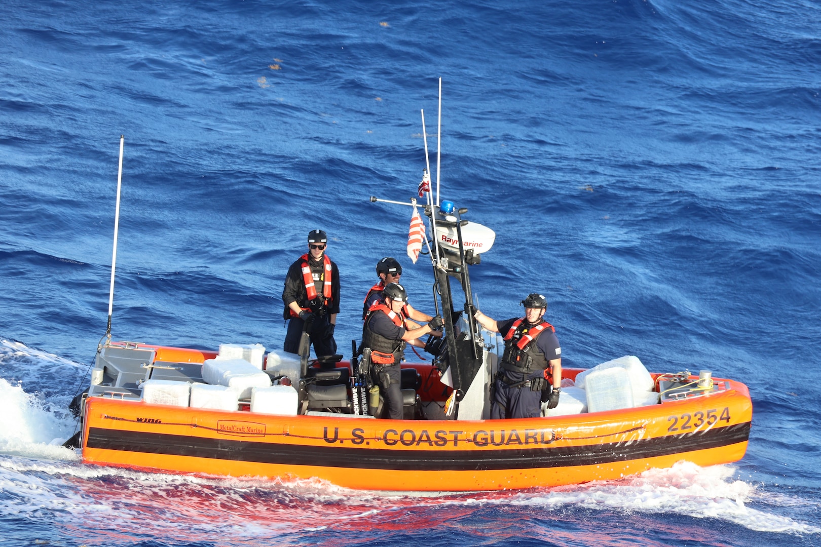 The crew members from Coast Guard Cutter Diligence recover jettisoned packages from a suspected drug smuggling vessel offshore of Puerto Oviedo, Dominican Republic, April 12, 2025. USCGC Venturous’ (WMEC 625) crew offloaded more than 1,294 pounds of cocaine and 4,012 pounds of marijuana valued at approximately $14.1 million intercepted in the Caribbean Sea. (U.S. Coast Guard photo)