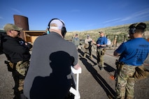 Master Sgt. Zachary McLaughlin, 75th Security Forces Squadron, briefs his team at the 2025 Law Enforcement Handgun Competition April 15, 2025 at the Big Salty Range, Salt Lake City, Utah. The competition fostered collaboration among agencies and provided an opportunity for participants to test their skills against counterparts from across the country. (U.S. Air Force photo by R. Nial Bradshaw)