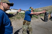 Tech. Sgt. Casey Luttrell, 75th Security Forces Squadron, competes in the 2025 Law Enforcement Handgun Competition April 15, 2025 at the Big Salty Range, Salt Lake City, Utah. The competition fostered collaboration among agencies and provided an opportunity for participants to test their skills against counterparts from across the country. (U.S. Air Force photo by R. Nial Bradshaw)