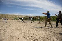 Senior Airman Tomas Read, 75th Security Forces Squadron, competes in the 2025 Law Enforcement Handgun Competition April 15, 2025 at the Big Salty Range, Salt Lake City, UtahThe competition fostered collaboration among agencies and provided an opportunity for participants to test their skills against counterparts from across the country. (U.S. Air Force photo by R. Nial Bradshaw)