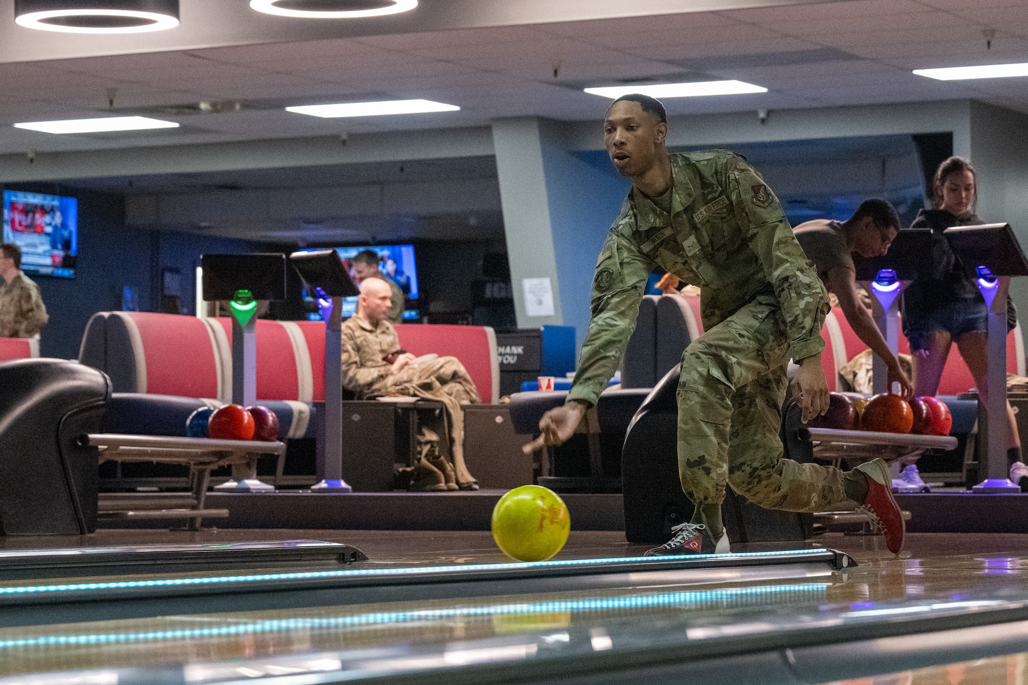 U.S. Air Force Airman 1st Class Kenyan Nixon, a ground transportation support operator assigned to the 773rd Logistics Readiness Squadron, rolls a bowling ball down a lane during the Strike Out Sexual Assault event at Joint Base Elmendorf-Richardson, Alaska April 25.