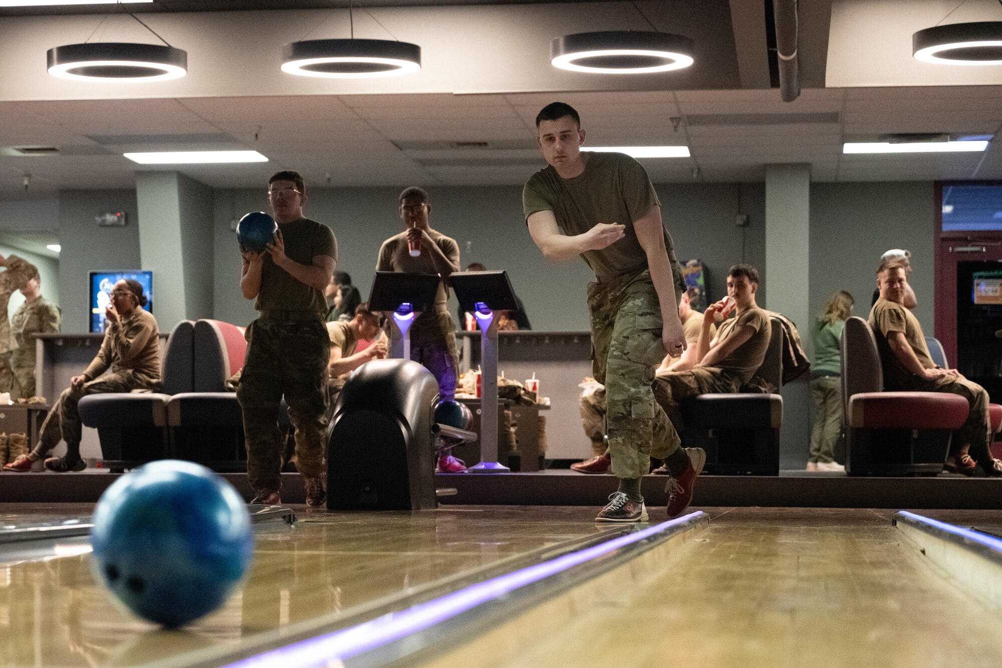 U.S. Air Force Airman Nathan Carver, a ground transportation support operator assigned to the 773rd Logistics Readiness Squadron, rolls a bowling ball down a lane during the Strike-Out Sexual Assault event at Joint Base Elmendorf-Richardson, Alaska April 25.