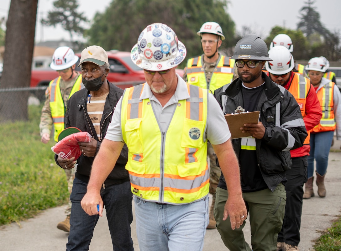 Darius Wallace, U.S. Army Corps of Engineers Los Angeles District employee and Eaton Wildfire survivor, second from left, participates in a walkthrough of his property April 30 in Altadena, California, with USACE personnel and contractors. Wallace has served with the USACE LA District for 43 years.