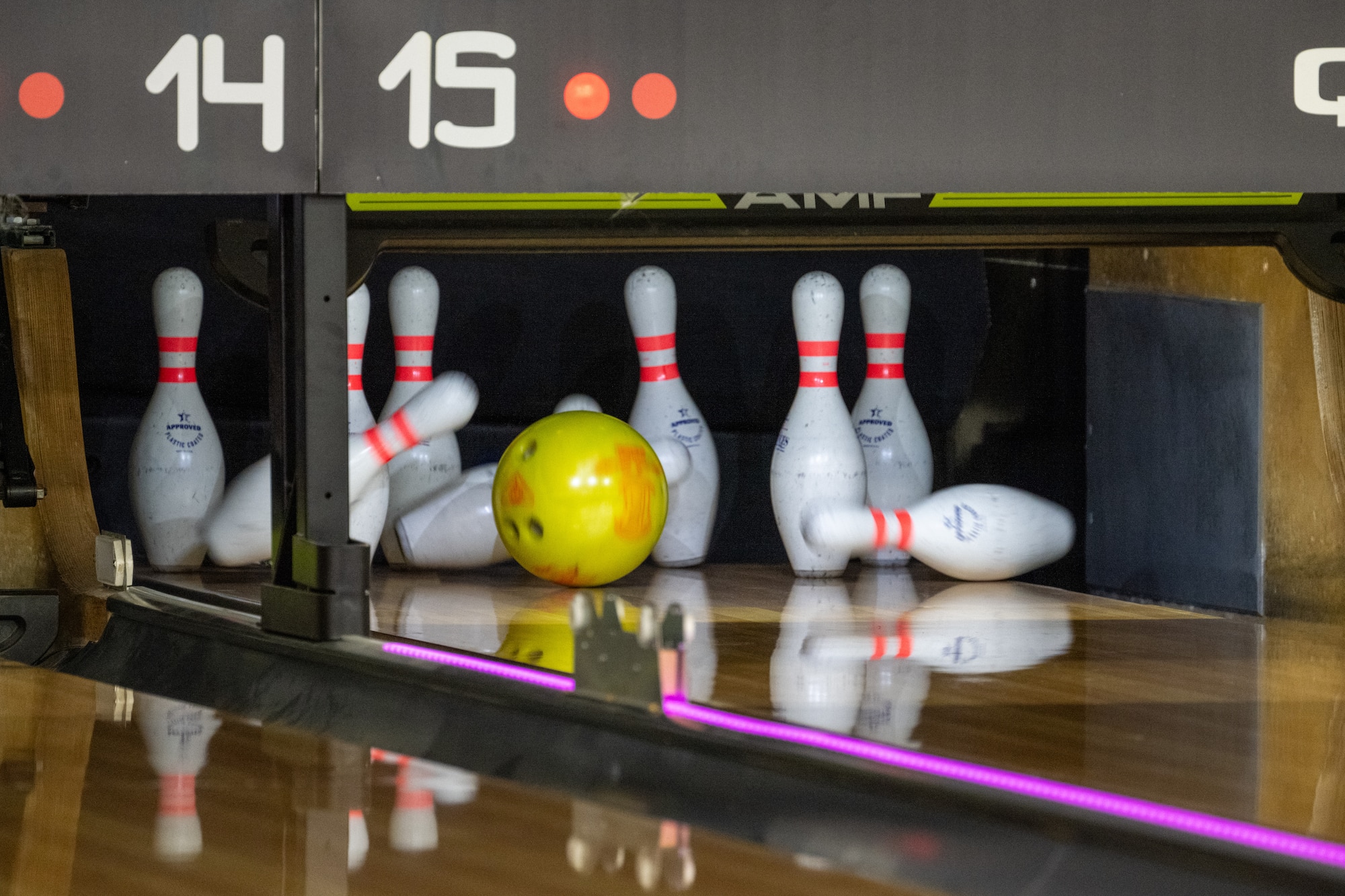 A bowling ball slams into bowling pins at the Strike-Out Sexual Assault event at Joint Base Elmendorf-Richardson, Alaska, April 25.