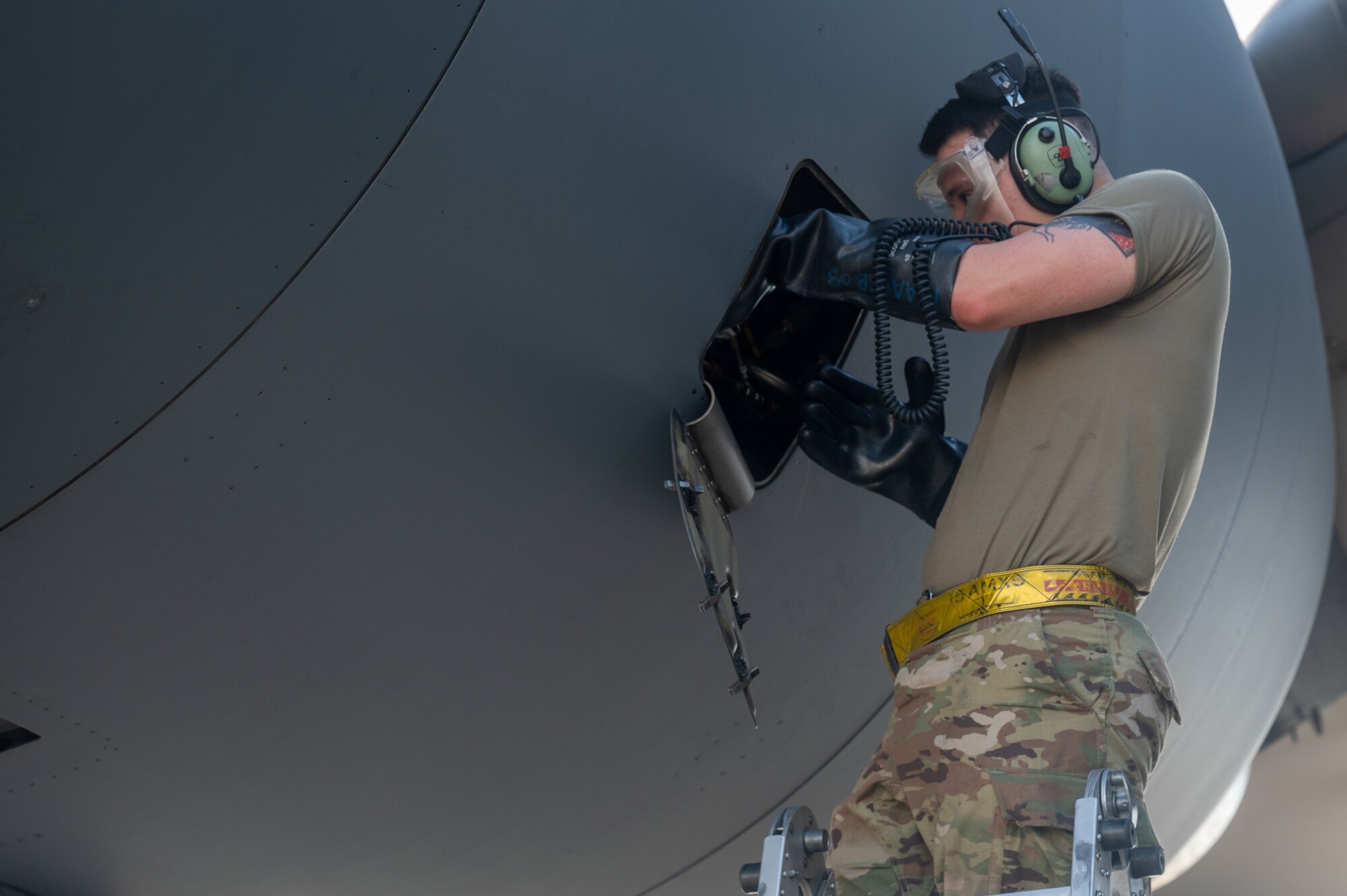 A U.S. Air Force Airmen does maintenance on a C-17 Globemaster III.