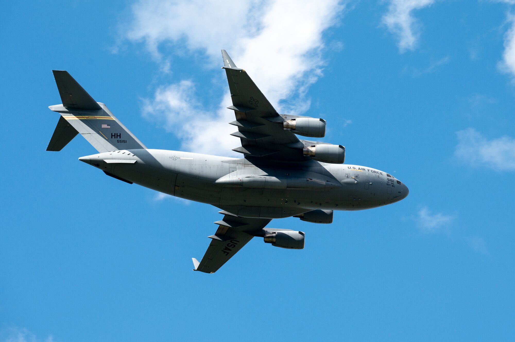 A U.S. Air Force C-17 Globemaster III flies by in the sky