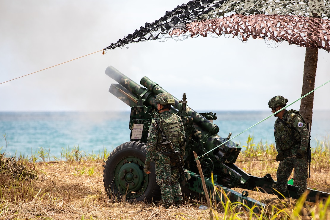Philippine Marines with the 3rd Marine Brigade load an M101 105mm Howitzer, a light field artillery weapon, as part of a counter landing live fire during Exercise Balikatan 25 at Rizal, Philippines, April 28, 2025.