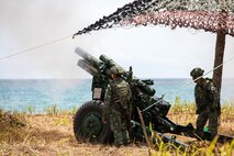 Philippine Marines with the 3rd Marine Brigade load an M101 105mm Howitzer, a light field artillery weapon, as part of a counter landing live fire during Exercise Balikatan 25 at Rizal, Philippines, April 28, 2025.