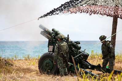 RIZAL, Philippines (April 28, 2025) — Philippine Marines with the 3rd Marine Brigade load an M101 105mm Howitzer, a light field artillery weapon, as part of a counter landing live fire during Exercise Balikatan 25 at Rizal, Philippines, April 28,...