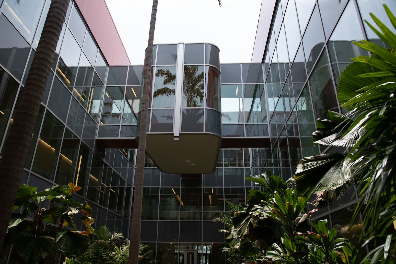 An exterior view of the Defense POW/MIA Accounting Agency family viewing room from the building’s atrium, April 25, 2025, on Joint Base Pearl Harbor-Hickam, Hawaii.
