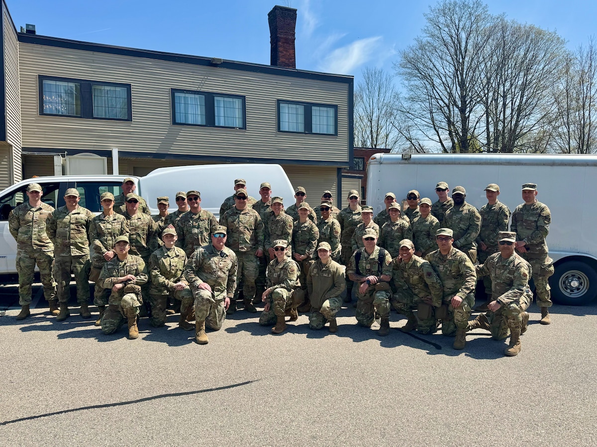 A photo of a large group of military medics standing outdoors in preparation for emergency medial operations.