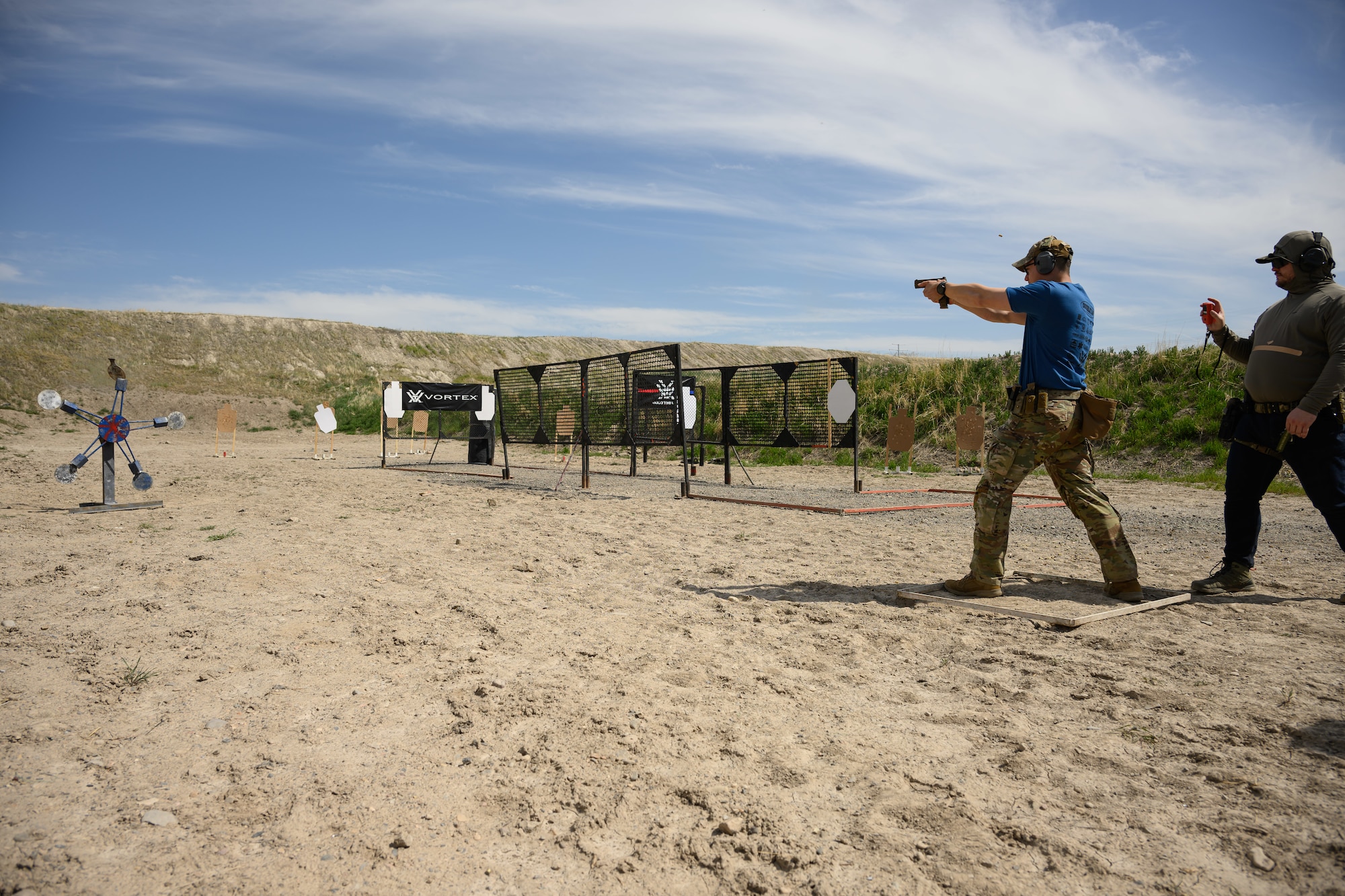 Senior Airman Tomas Read, 75th Security Forces Squadron, competes in the 2025 Law Enforcement Handgun Competition April 15, 2025 at the Big Salty Range, Salt Lake City, UtahThe competition fostered collaboration among agencies and provided an opportunity for participants to test their skills against counterparts from across the country. (U.S. Air Force photo by R. Nial Bradshaw)
